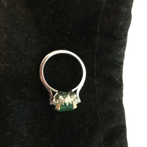Stamped platinum ladies emerald in 18k gold claws dinner ring